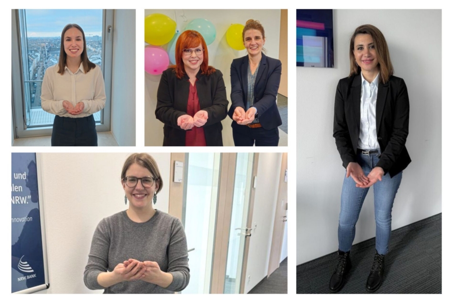 Mitarbeiterinnen der NRW.BANK zeigen die Geste zum Weltfrauentag 2026 unter dem Motto "Give To Gain".